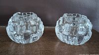 Pair of Kosta Boda Igloo clear textured glass votive candle holders photographed side by side
