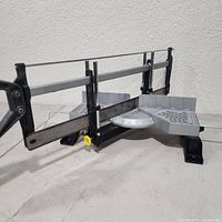Front angled view of the Stanley adjustable angle mitre saw showing blade, protractor base and frame.