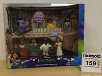 Front view of Disney Encanto 'We Don't Talk About Bruno' figurine set in original packaging showing six characters on a two-level stage.