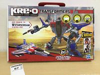 Front of the KRE-O Transformers Starscream box, showing the 316-piece building set in fighter jet and robot mode. Includes 2 Kreon mini-figures.