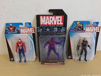 Front view of three Marvel action figures: Iron Patriot, Wonder Man, Hawkeye in packaging