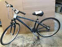 Full side view of bicycle showing frame, wheels, and accessories