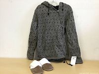 Gray wool sweater with black dotted pattern, hood, front zipper, and two front pockets. Small size.