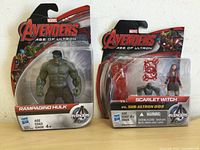Front view of the Rampaging Hulk and Scarlet Witch figures in their Avengers Age of Ultron packaging showing the characters and branding.