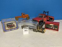 Image showing all five vintage toy trucks and boxed collectible models.