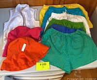 Overview photo showing all shorts, hats, and vest.