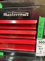 Front view of tool box showing Mastercraft logo and four drawer handles.