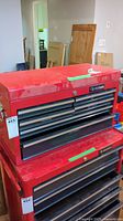 Front view of red Husky tool chest with six drawers.