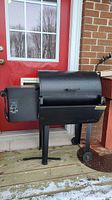 Front side view of Traeger smoker on deck