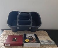 Photo showing gray plastic Sterlite multitasking household caddy and three audiobook collections in cases