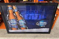Framed Bud Light UFC promotional poster showing two Bud Light bottles and a UFC octagon fight scene