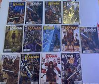 All 13 issues from Star Wars Kanan The Last Padawan series, issues 1 through 12 plus an extra issue #2, laid out flat on a surface.