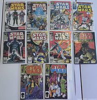 Front view showing all nine comics including key issues and the annuals, all boarded and bagged.