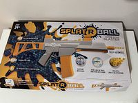 Box front showing SplatRBall branding, product features, and age recommendation