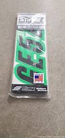 Front view of sticker decal package showing green number decals, made by Stiffie for boat registration.