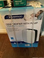 Boxed Garrison dehumidifier front view showing branding and basic specifications.