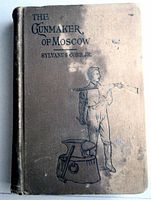 Front view of the vintage book cover showing title, author, publisher illustration, and discoloration.