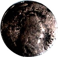 Front side of the vintage 1656 France Liard de France coin with faint profile and heavy wear.