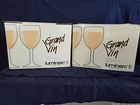 Boxes of Luminarc Grand Vin wine glasses, original packaging showing model name and brand.