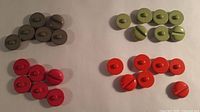 All four colour groups of round slot-design buttons
