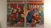 Both Iron Man comic books side by side, full front covers visible