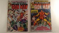 Front covers of both Iron Man comics together