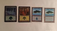 All four land cards side by side