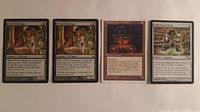 Four Magic cards laid out: two Elvish Harbinger, Mishra's War Machine, Lightining Greaves