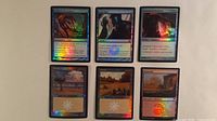 All six foil cards displayed in two rows