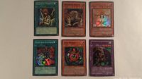 All six Yu-Gi-Oh! cards laid out in two rows of three