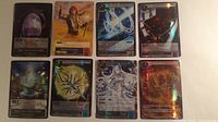 All eight foil cards laid out, 4 top 4 bottom