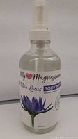 Front of 250 ml Blue Lotus Magnesium Body Mist bottle showing label and pump