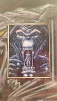 Framed sketch showing detailed monster face with Chakan figure, signature visible
