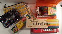 Group shot showing all art supplies and pencil cases