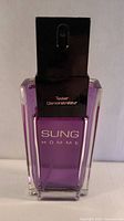 Front view of Sung Homme tester bottle showing branding and purple liquid