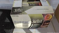 Box of Northland Classic Fire Logs with 3-hour burn time printed on packaging.