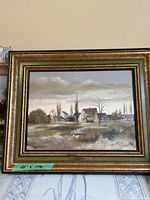 Framed oil painting on board showing overall appearance and condition