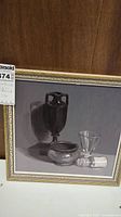 Front view of the framed oil on board painting with still life composition on gray background.