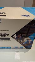 Original box of Lorex HD security system showing brand name, 4 cameras, and 1080p video resolution.