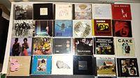 Top view of first set of music CDs, showing various album covers including The Allman Brothers Band, Ramones, Nirvana, The Doors, and Cake.