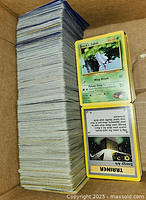 Stack of Pokemon cards showing front of Brock's Zubat and Energy Removal Trainer card.