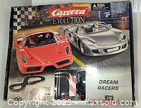 Original boxed set for Carrera Evolution Dream Racers, featuring two sports cars on front, sports car model images, and track layout details.