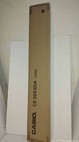 Photo of the original Casio keyboard stand box showing the model number CS-30X(D)A and Casio branding.