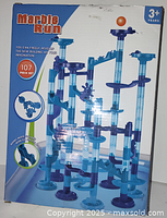 Box front showing assembled marble run and product details