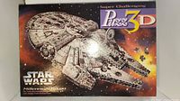 Front of sealed box showing Puzz3d Star Wars Millennium Falcon 3D Puzzle.