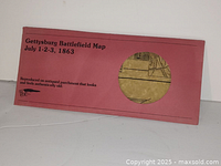 Box packaging of Gettysburg Battlefield Map July 1-3, 1863 showing reproduction on antiqued parchment with a sample cutout.