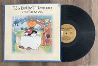 Vinyl LP record titled Tea For The Tillerman by Cat Stevens with original cover sleeve featuring illustrated artwork.