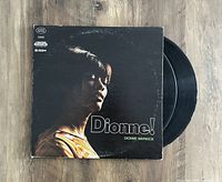 Photo of the front cover of the vinyl album "Dionne!" by Dionne Warwick showing side profile image of the artist and vinyl partly visible