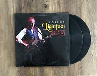Gordon Lightfoot All Live double vinyl LP with sleeve on wooden surface