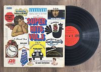 Front cover and vinyl of The Super Hits Vol. 3 album showing artist and song names on colorful artwork and the vinyl disc with red Atlantic label.